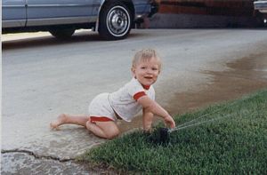 Sprinkler Daddy's Sean Stefan playing with sprinklers at about age 3
